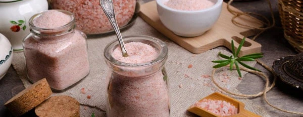 pink Himalayan salt in various containers