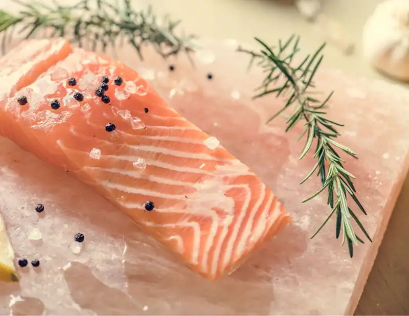 cooking salmon on a Himalayan salt block