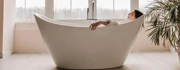 epsom salt bath woman soaking in bathtub