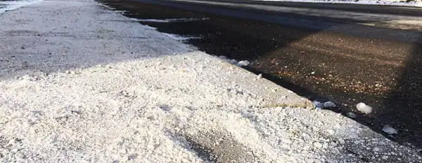 rock salt on icy roadway