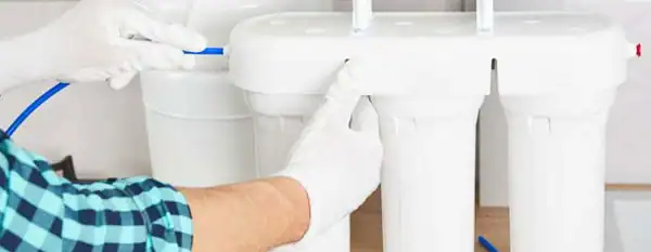 technician installing reverse osmosis system