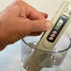meter measuring total dissolved solids in drinking water