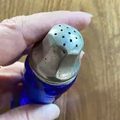 Vintage salt shaker cobalt blue glass and metal lid with holes
